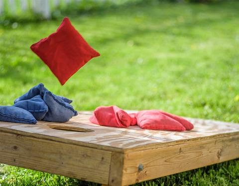 Outdoor corn hole game