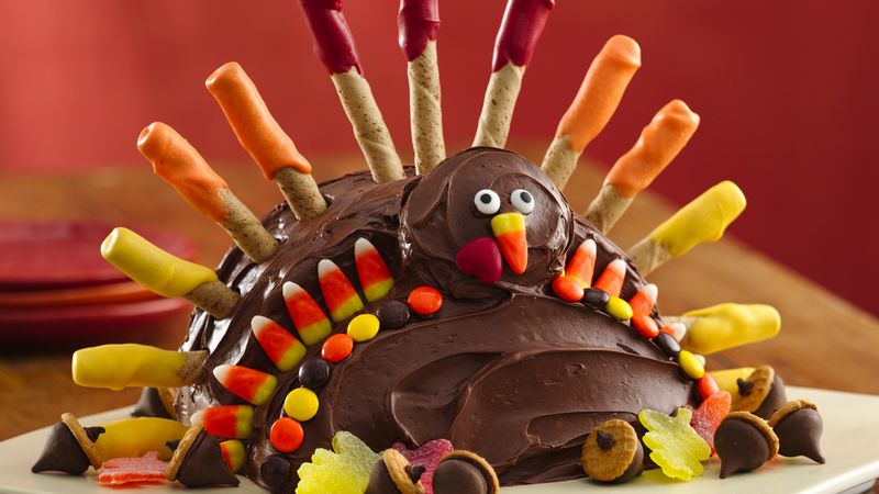 Turkey shaped cake for Thanksgiving dessert that includes holiday candy