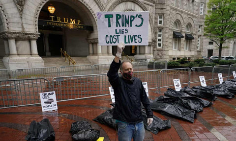 Demonstrators protest on 23 April against the Trump administration’s handling of the Covid-19 pandemic. Photograph: Kevin Lamarque/Reuters