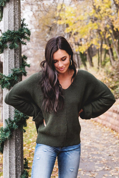 dark green sweater