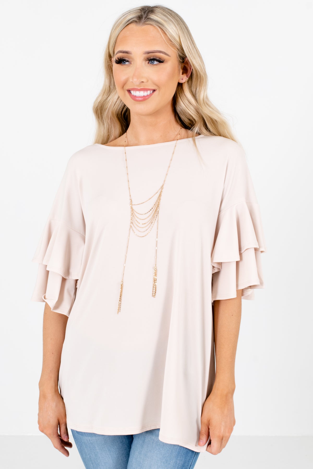 beige ruffle top