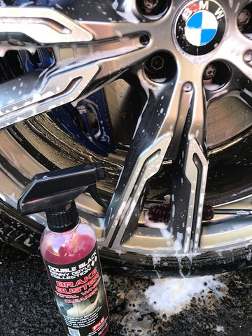 washing wheel of car with detailing shed product
