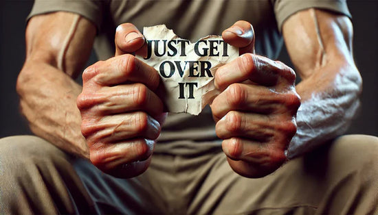 A close-up of human hands firmly holding a torn piece of paper with the words 