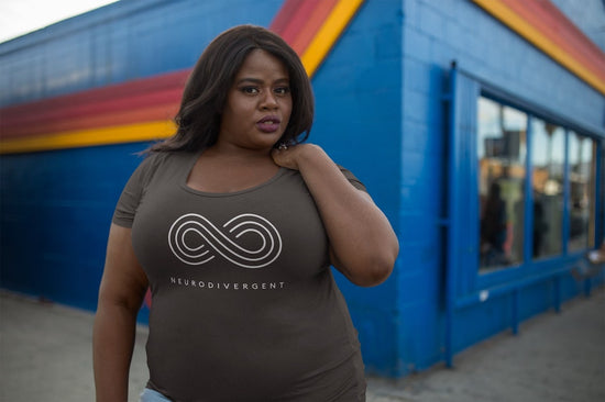 gifts for autistic adults: a Black woman is wearing a t-shirt with the word neurodivergent printed on the front