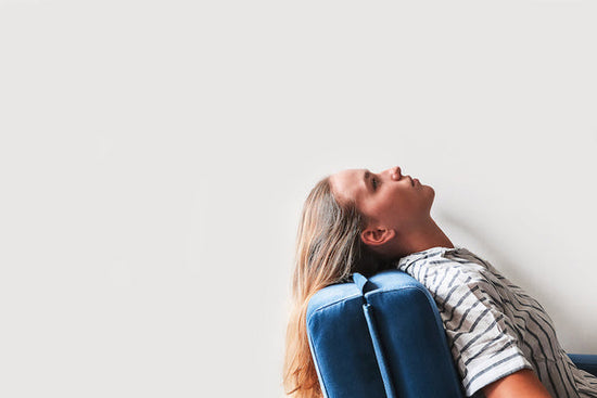 How therapy failed me: a side-view of woman sitting alone in a chair staring at the ceiling. 