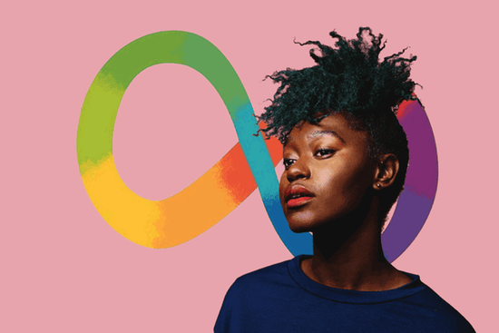 Homepage Image: Person with green/black Afro hair and red lipstick poses in front of the Autism rainbow infinity symbol.Image for an article on how to create an autism friendly workplace.