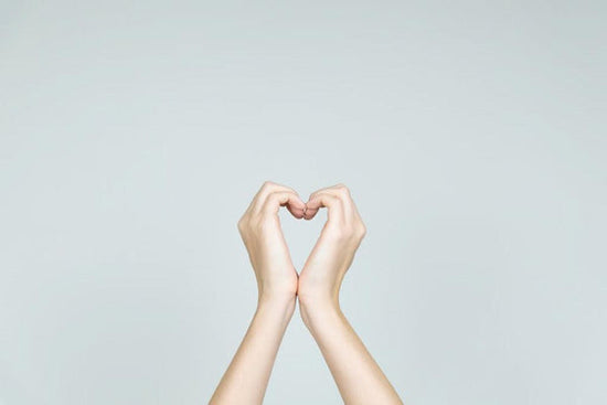 Image for man article: is palliative care just for the dying? Image conveys a concept of love and kindness concept: hands forming the shape of heart. Heart formed of female hands in neutral background.