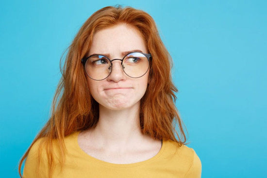 Close up Portrait young redhair woman with eyeglass worrying about having OCD groinal response and OCD sexual thoughts about family.