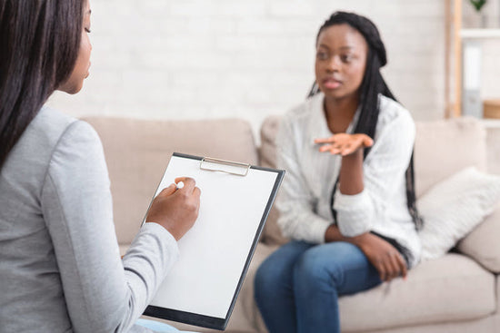 Therapist's least favourite client: a photo of a therapist taking notes during therapy session with her female patient