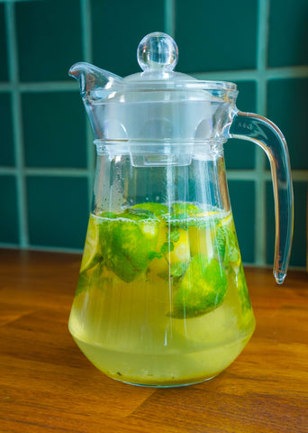 Zero-waste lemon tea made with lemon and lime peels, mint, hot water and Copra's organic coconut nectar