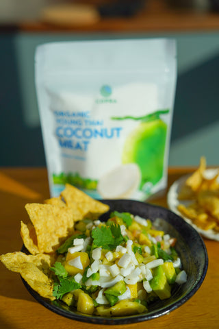 Coconut salsa served with corn nacho chips and Copra's organic young Thai coconut meat