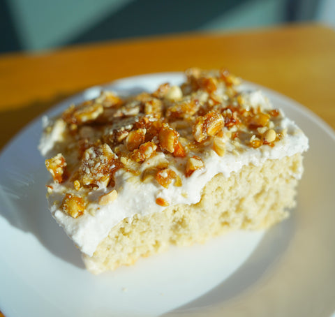 Coconut tres leches made with organic coconut nectar and homemade peanut brittle