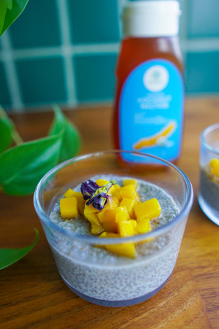 Butterfly Pea Chia Pudding with fresh mangoes and Copra's organic coconut nectar
