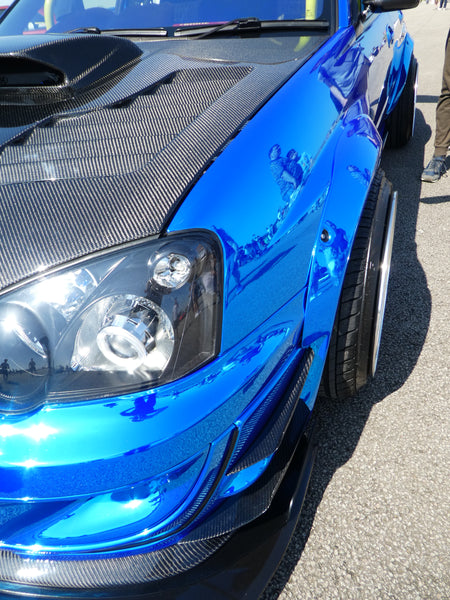 Subaru WRX with Stretched Tyres and blue chrome wrap