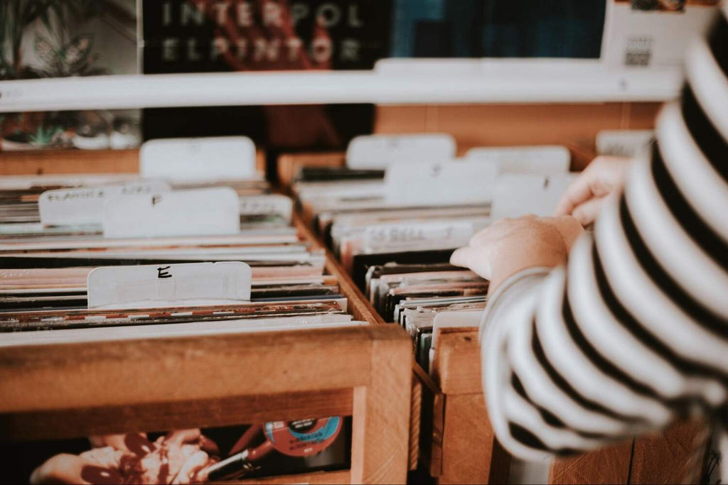 person looking through vinyl record selection