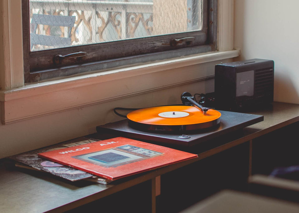 vinyl records near bedroom window 