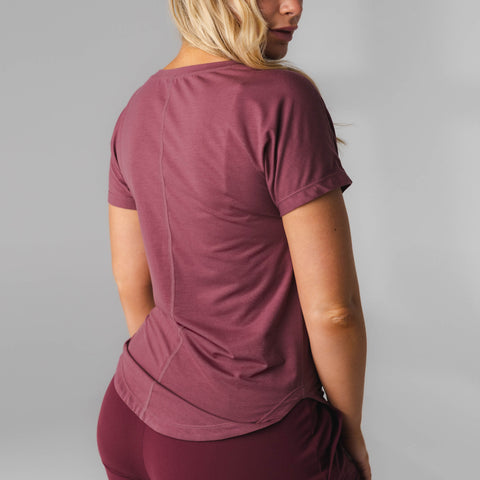 The Versa Full Tee for women has a scoop hem