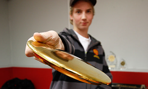 Seppo Paju holding a golden disc