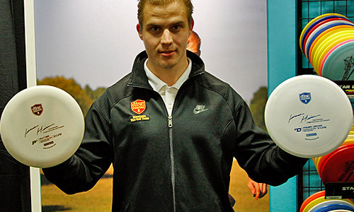 2-time Finnish Champ Jesse Heinonen with his 2 signature discs