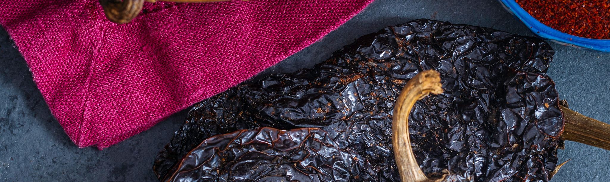 what is difference between ancho pepper and regular pepper?