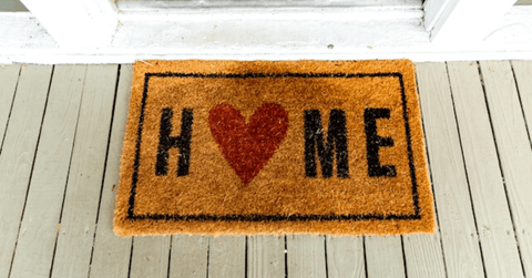  A yellow doormat with the word HOME on it.