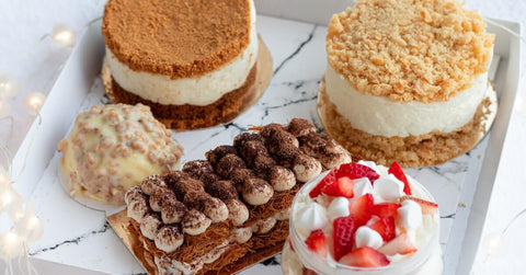 A set of delicious desserts served in plastic containers.