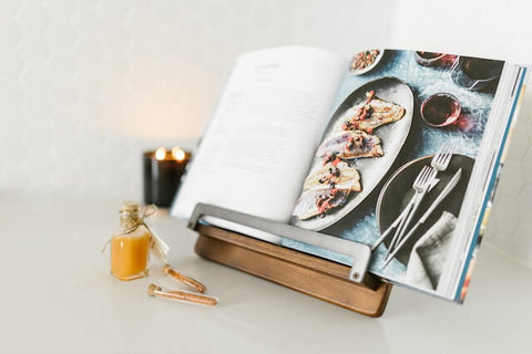 An open cookbook on a stand