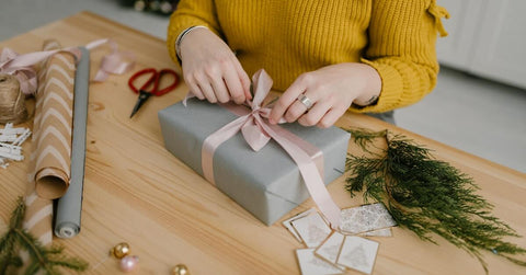 A person tying a bow