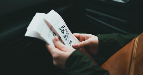 a person holding tickets