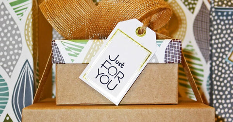 Wrapped gifts with a card that says “Just for you.”