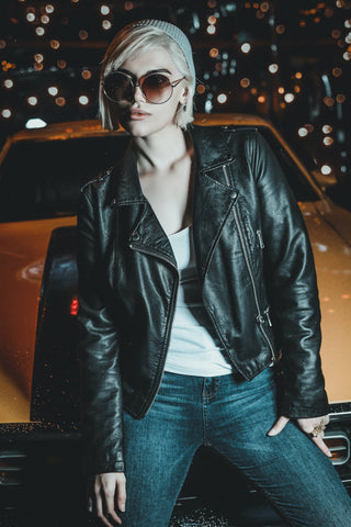 Girl posing with a leather jacket and jeans