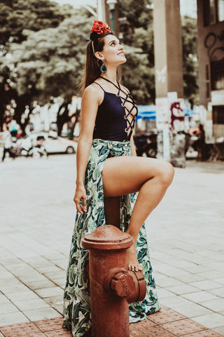 Woman posing with a floral maxi skirt and a black top