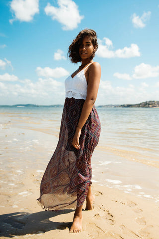 Woman posing on the beach with a summer maxi dress