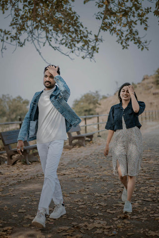 A couple wearing casual outfits with denim jackets