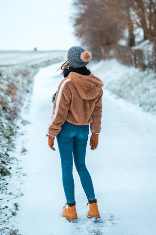 Girl wearing a fleece jacket and jeans
