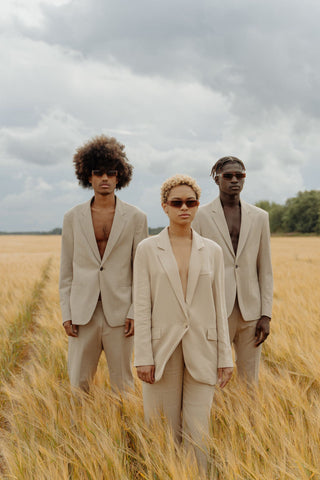 Trio wearing a neutral-colored suits