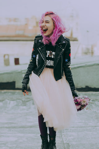 Girl wearing a tulle skirt and leather jacket