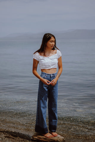 Pompeii outfit white crop top and wide-leg jeans