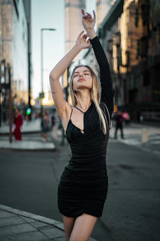Girl posing with a mini black dress