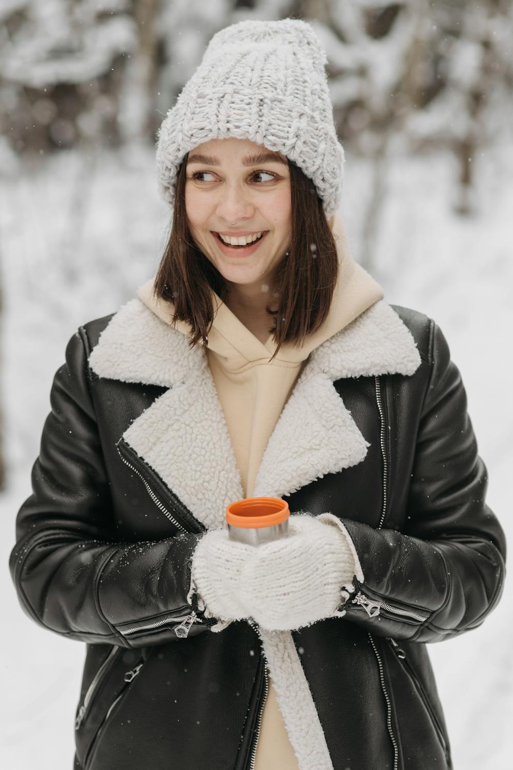 Wearing Hunter boots in the snow - vegan leather jacket