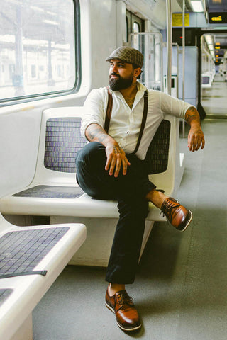 Men in a metro wearing a retro-inspired outfit