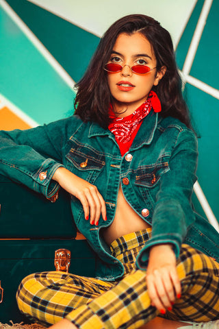 Girl posing with red bandana denim jacket and plaid pants