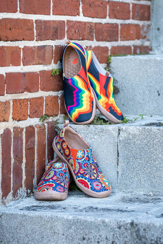 Photo of two pairs of colorful slip-on sneakers