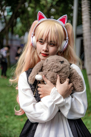 Girl posing with plush backpack