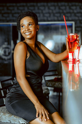 Happy woman in a black cocktail dress