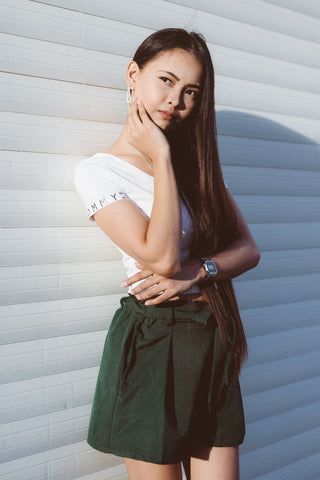 Pompeii outfits girl wearing tailored shorts and a white tee