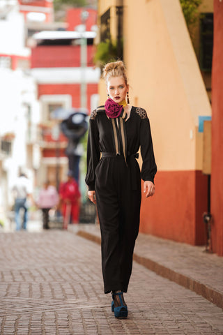 Woman wearing a black fancy jumpsuit