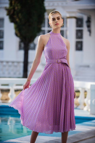 Woman in an elegant pleated midi dress