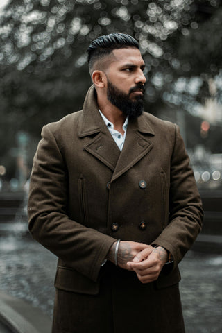 Close photo of a man wearing a double-breatsed jacket