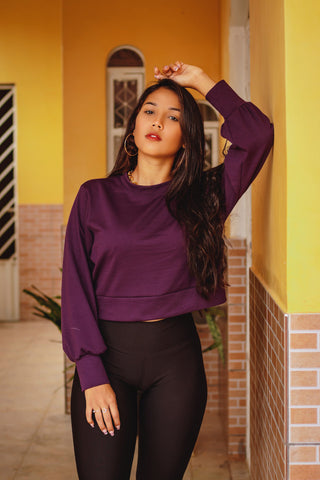 Young woman posing with a cotton jumper and black leggings